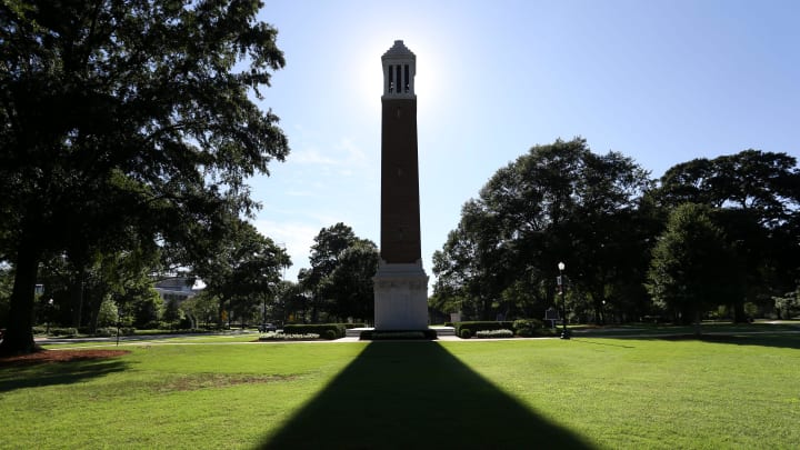 The Denny Chimes cast a long shadow on the Quad as the sun eases toward the horizon. [Staff Photo/Gary Cosby Jr.]Denny Chimes Shadow